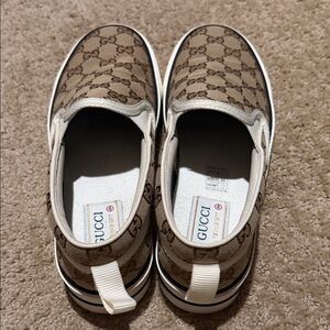 Gucci woman’s Tan Monogram Slip-On Sneakers